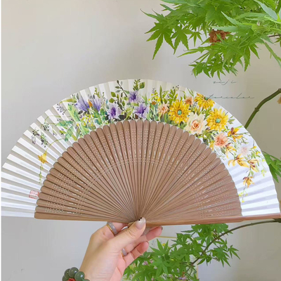 Handmade fan with watercolor painting spring flowers
