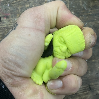 Horny monster - (unpainted green rubber with solid black felt vest)