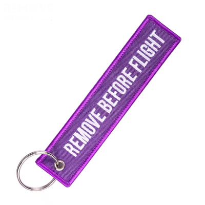 Remove before flight keychain