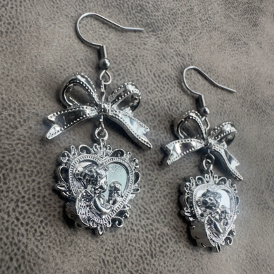Silver bowknot baroque cherub heart drop earrings